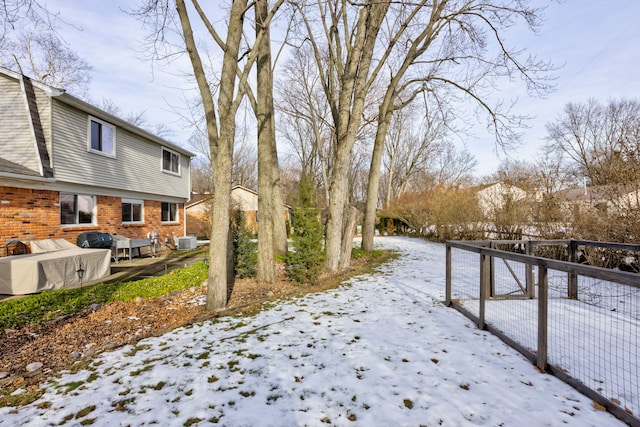 view of yard covered in snow