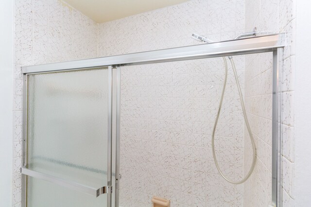 room details featuring a shower with shower door