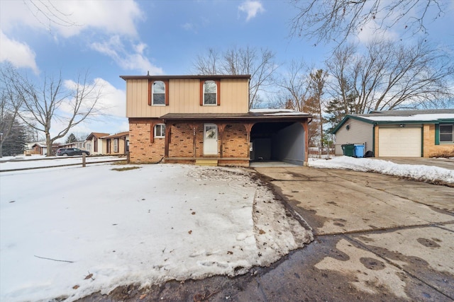 front of property with a carport and a garage