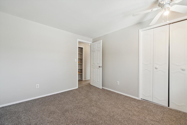 unfurnished bedroom featuring carpet floors, ceiling fan, and a closet