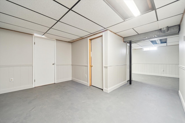 basement featuring a paneled ceiling