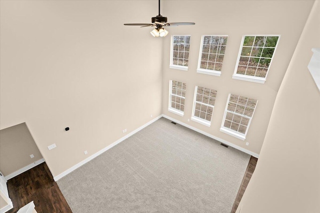 carpeted empty room with ceiling fan