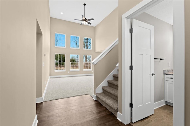 interior space with ceiling fan and light hardwood / wood-style floors