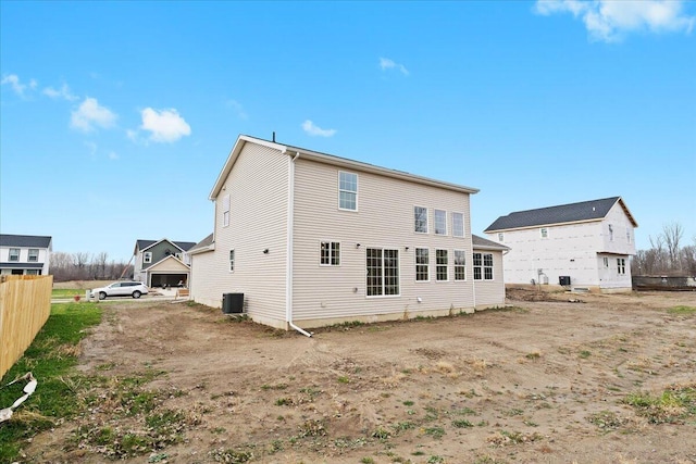 back of house with central AC