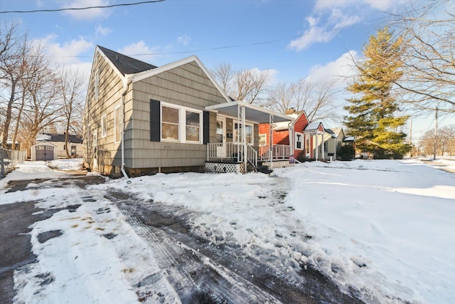 view of front of house with a storage shed and covered porch