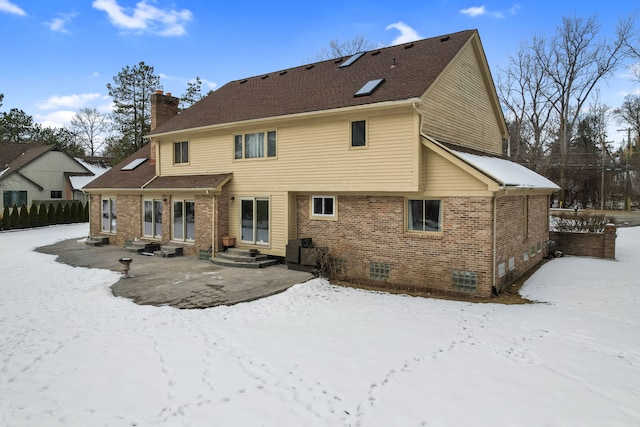 view of snow covered house