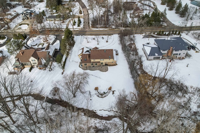snowy aerial view featuring a residential view