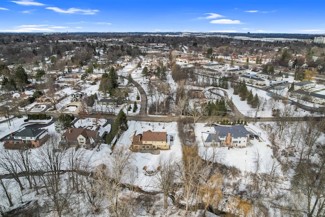 snowy aerial view with a residential view