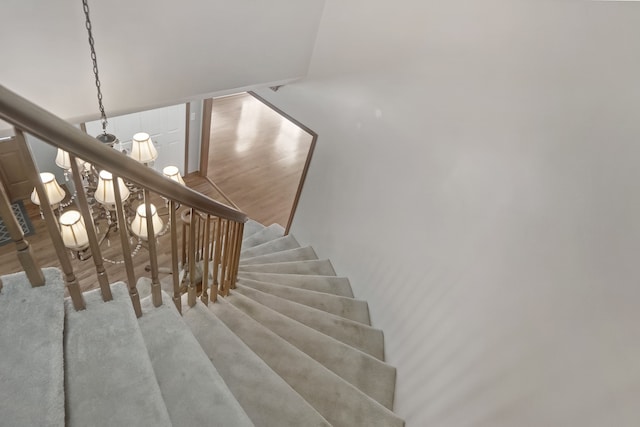 staircase featuring wood finished floors