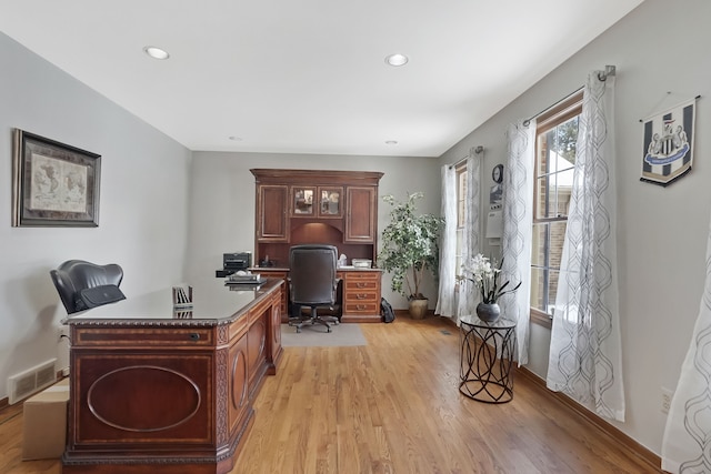 office space with light hardwood / wood-style floors