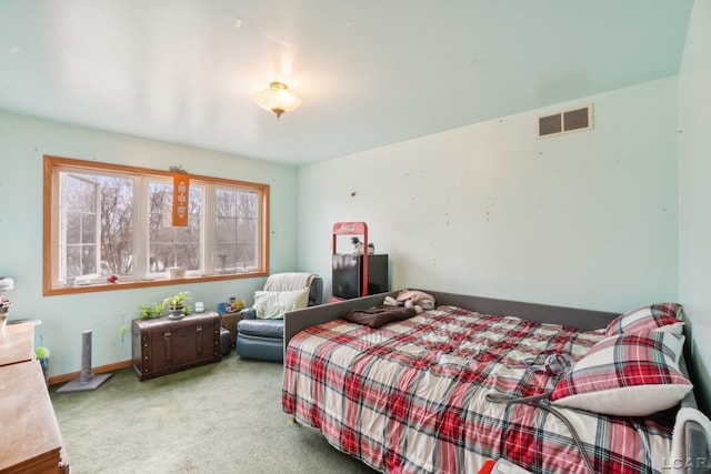 bedroom featuring light carpet