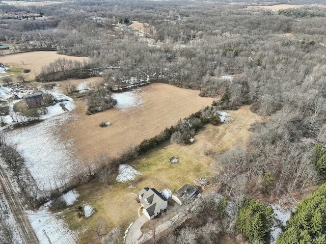 birds eye view of property with a rural view