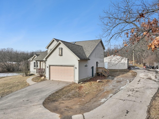 view of side of home featuring a garage