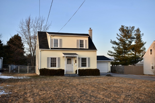 view of front of home with a garage and a front lawn