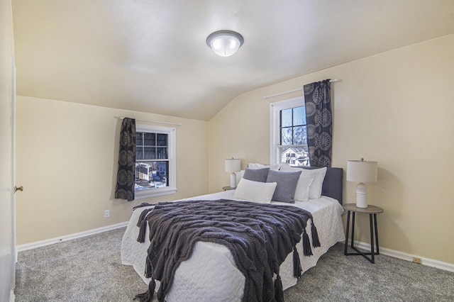 bedroom featuring vaulted ceiling and carpet