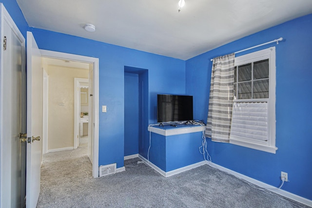 unfurnished bedroom featuring carpet flooring