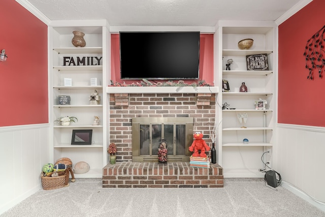 carpeted living room featuring a fireplace, built in features, and a textured ceiling