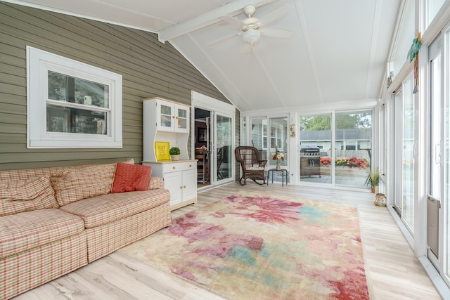 sunroom with vaulted ceiling with beams and ceiling fan