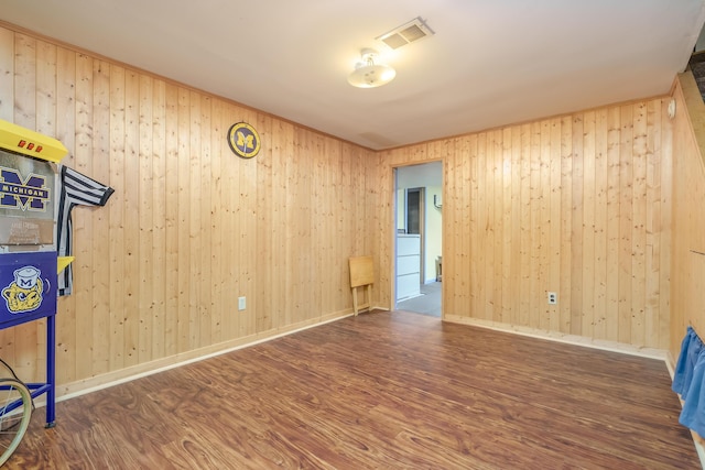 empty room with dark hardwood / wood-style floors