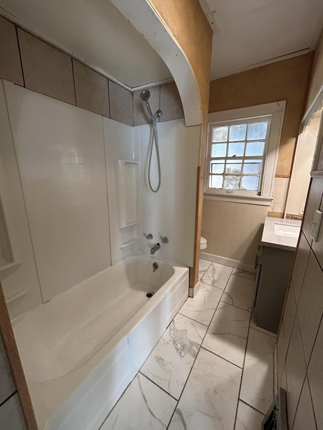 full bathroom with vanity, bathing tub / shower combination, and toilet