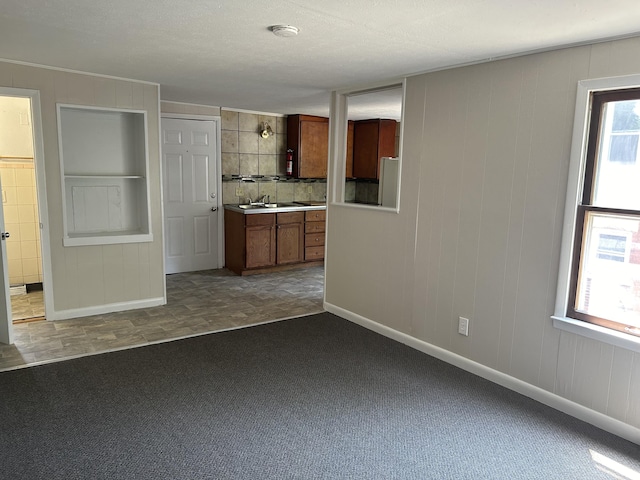 unfurnished living room with carpet flooring