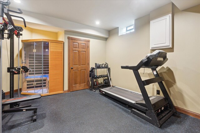 exercise room with recessed lighting and baseboards