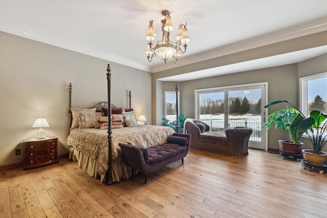 bedroom featuring crown molding, light wood-type flooring, baseboards, and access to outside