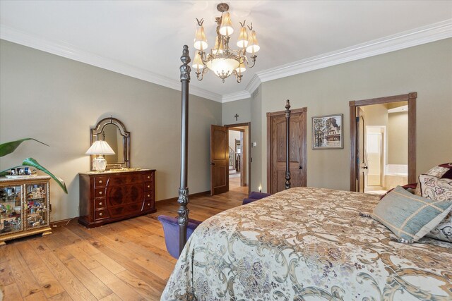 bedroom featuring baseboards, a chandelier, ornamental molding, light wood-style floors, and ensuite bath