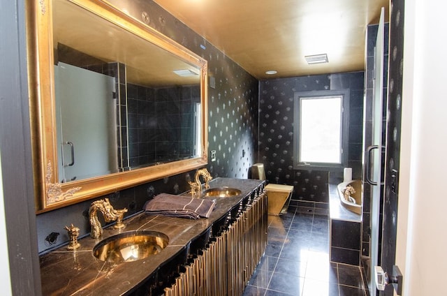 bathroom with vanity, toilet, and tile patterned flooring