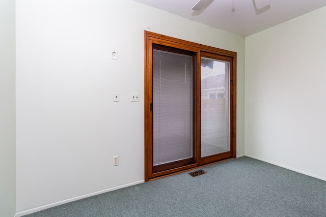 unfurnished room featuring carpet and ceiling fan