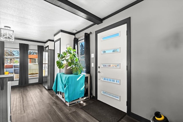 entryway with beam ceiling, crown molding, and dark wood-type flooring