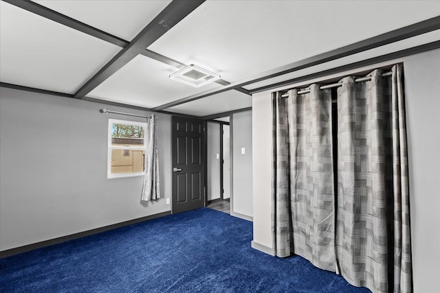 carpeted spare room with baseboards