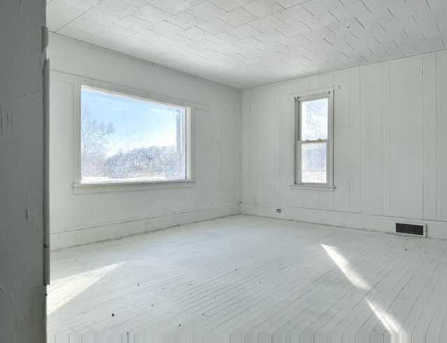 spare room featuring light hardwood / wood-style floors