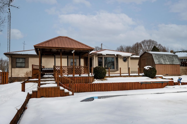 view of front facade with a storage shed