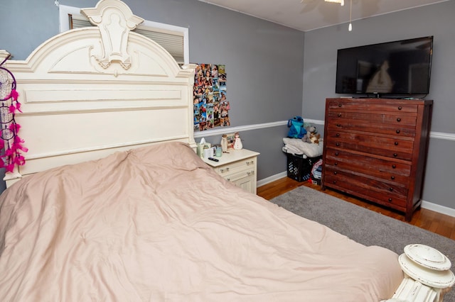 bedroom with hardwood / wood-style flooring