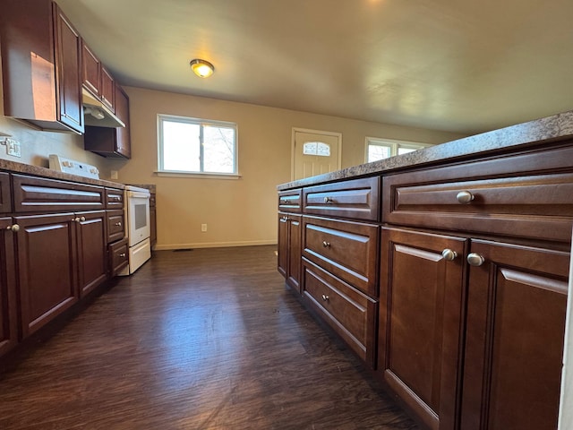 kitchen featuring white electric range and dark hardwood / wood-style floors