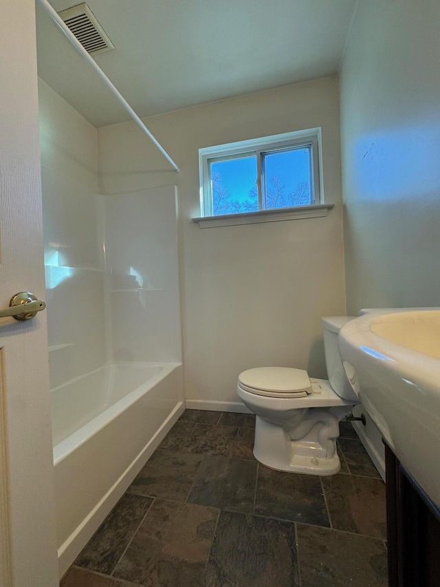 bathroom with shower / bathtub combination and toilet