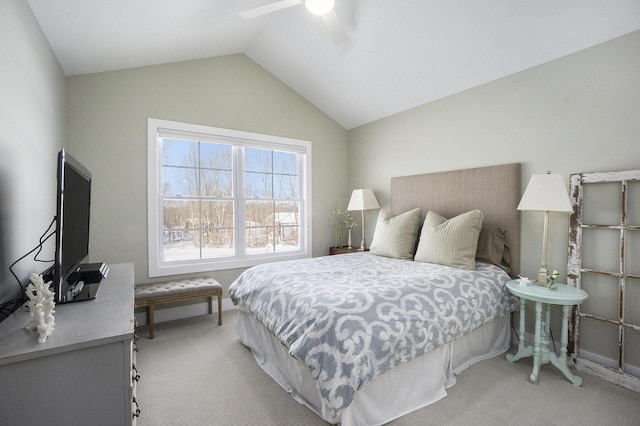 carpeted bedroom with ceiling fan and vaulted ceiling