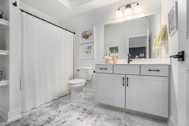 bathroom with vanity and toilet