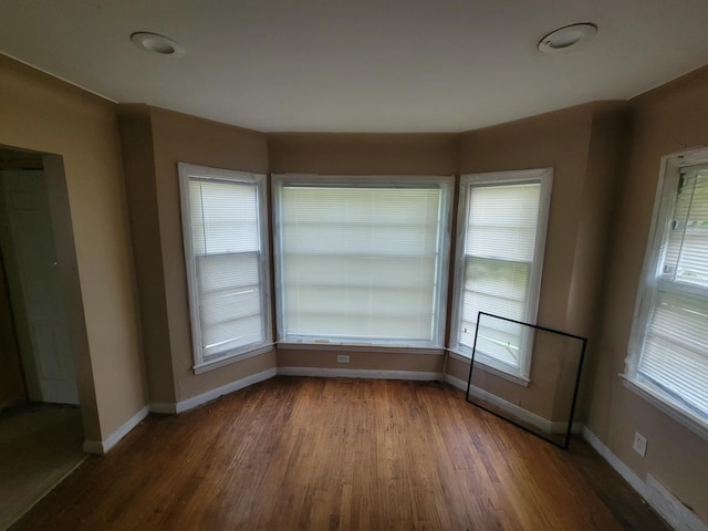 spare room with hardwood / wood-style flooring