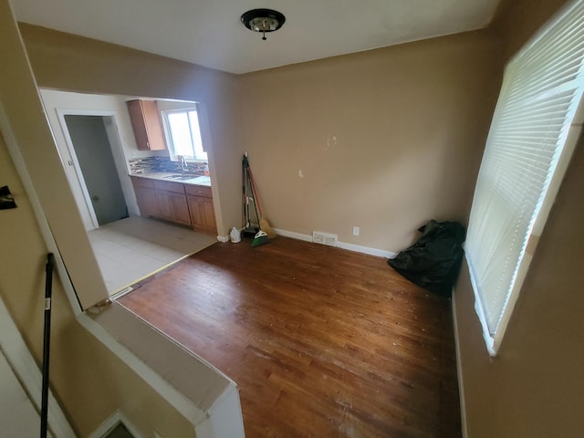 interior space featuring sink and light hardwood / wood-style flooring