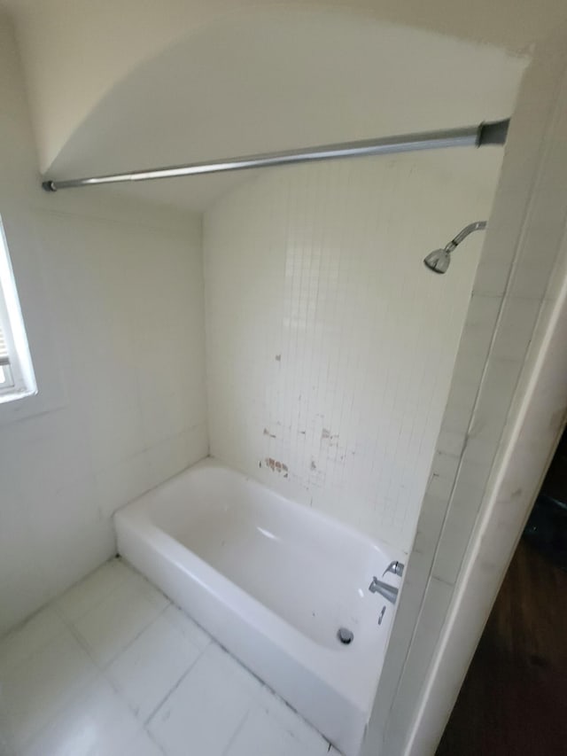 bathroom featuring a tub and tile patterned floors