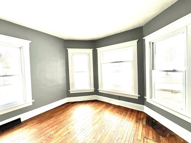 spare room featuring light hardwood / wood-style flooring