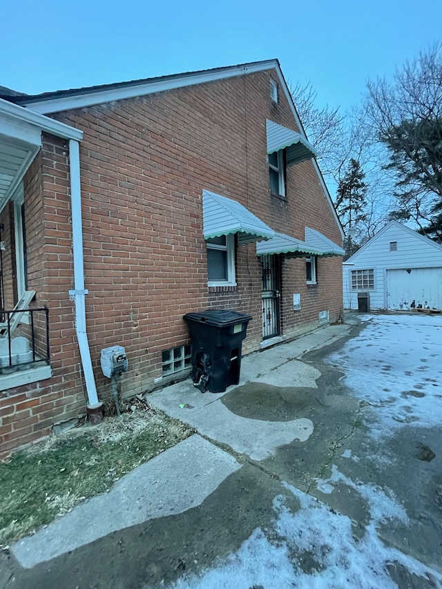 view of side of home with an outbuilding and a garage