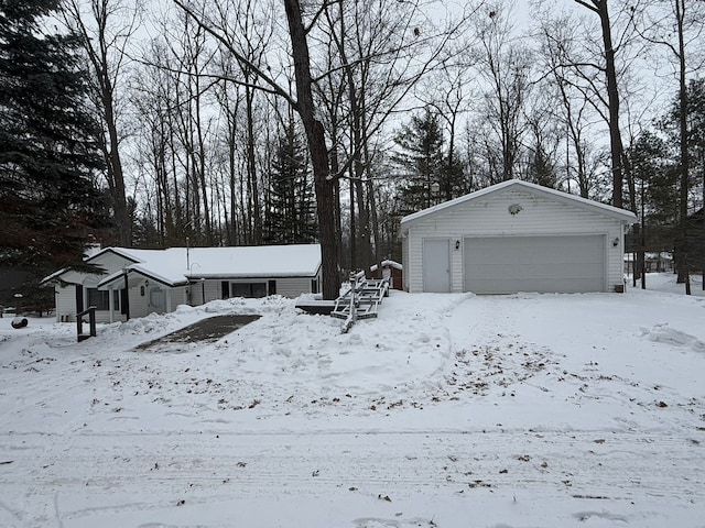 exterior space with a garage and an outdoor structure