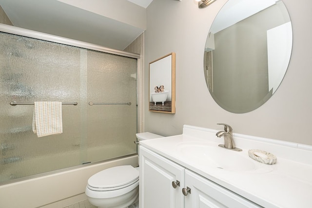 full bathroom with vanity, combined bath / shower with glass door, and toilet