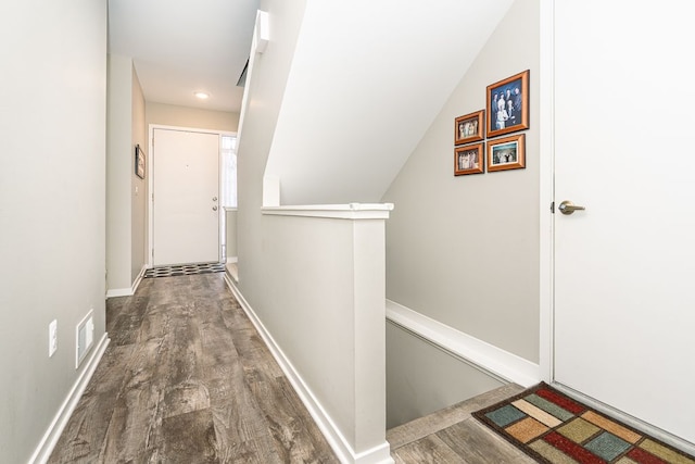 corridor featuring dark wood-type flooring