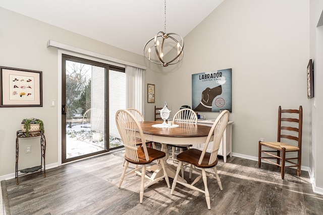 dining area with high vaulted ceiling, a notable chandelier, and dark hardwood / wood-style flooring