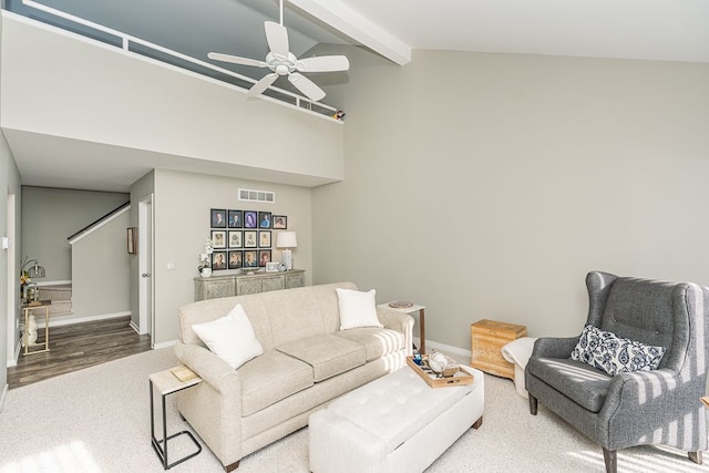 living room featuring ceiling fan, high vaulted ceiling, wood-type flooring, and beam ceiling