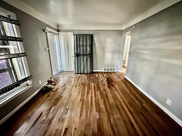 unfurnished room featuring hardwood / wood-style flooring